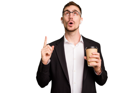 Young business caucasian man drinking a coffee isolated cutout pointing upside with opened mouth.