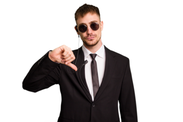 Security bodyguard man wearing a suit isolated cut out showing a dislike gesture, thumbs down. Disagreement concept.