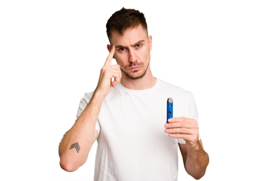 Young caucasian man holding a vaporizer cut out isolated pointing temple with finger, thinking, focused on a task.