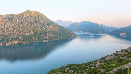 Beautiful view of the Bay of Kotor at sunset. Fjord of Montenegro. Boat tour of the fjord.