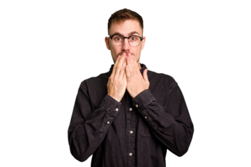 Young caucasian man cut out isolated shocked, covering mouth with hands, anxious to discover something new.