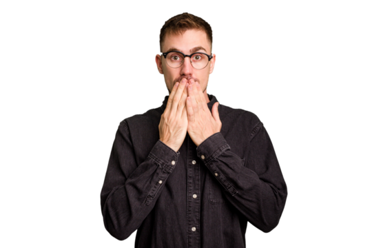 Young caucasian man cut out isolated shocked, covering mouth with hands, anxious to discover something new.