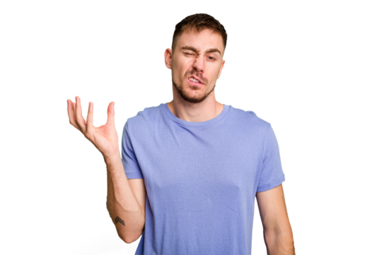 Young caucasian man cut out isolated doubting and shrugging shoulders in questioning gesture.