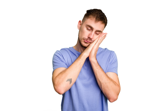 Young caucasian man cut out isolated yawning showing a tired gesture covering mouth with hand.