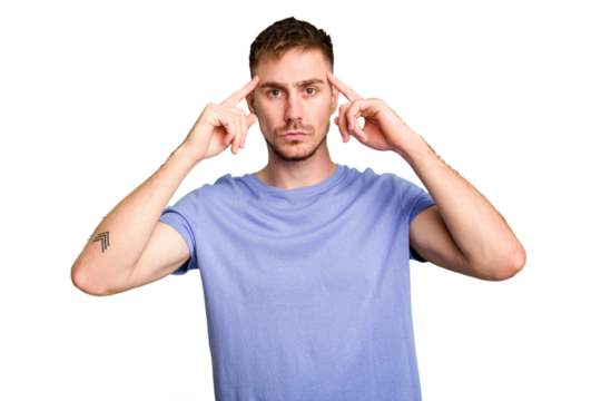 Young caucasian man cut out isolated focused on a task, keeping forefingers pointing head.