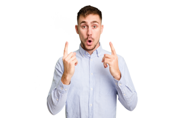 Young caucasian man cut out isolated pointing upside with opened mouth.