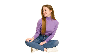 Young redhead woman sitting on the floor cut out isolated sad, serious face, feeling miserable and...