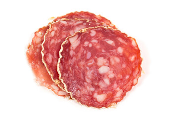 Slices of salami sausage on a white background