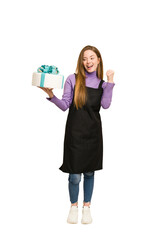 Full body photo of a young redhead woman holding a sweet cake cut out isolated