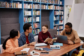 Diverse group of young people studying together