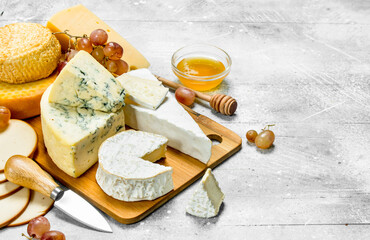 Different kinds of cheese with honey.