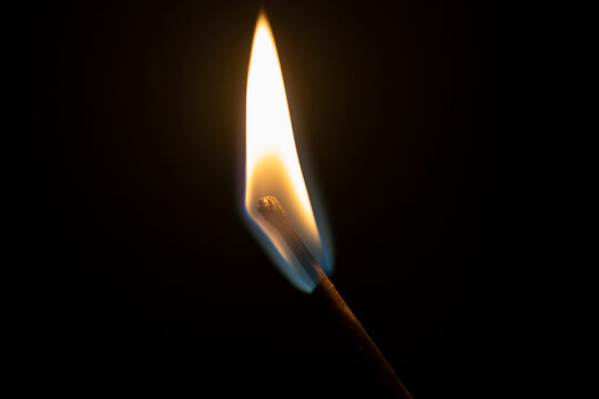 Match flame on black background closeup
