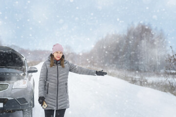 Girl on the road near the car..