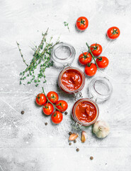 Tomato sauce in a jar of herbs, garlic and cherry.