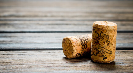 Wine corks on wooden background.