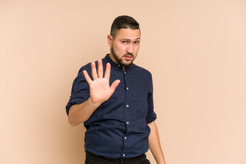 Adult latin man cut out isolated rejecting someone showing a gesture of disgust.