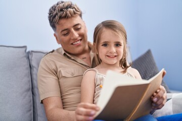 Father and daughter father and daughter writing on notebook at home