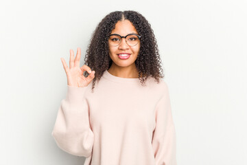Young african american woman isolated on white background cheerful and confident showing ok gesture.