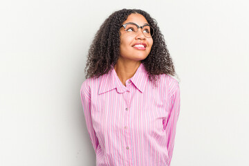 Fototapeta premium Young african american woman isolated on white background relaxed and happy laughing, neck stretched showing teeth.