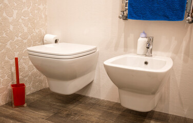 Naklejka na ściany i meble Closeup of the toilet and bidet in a luxury bathroom.