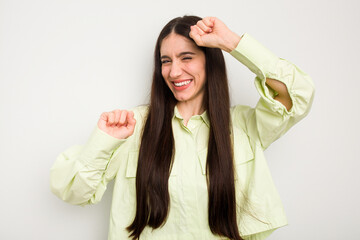 Fototapeta premium Young caucasian woman isolated on white background celebrating a special day, jumps and raise arms with energy.