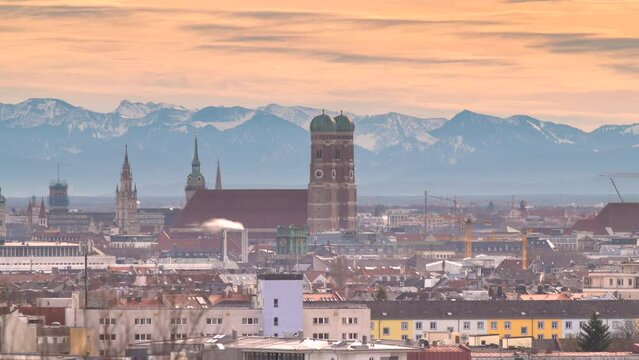 Munich skyline aerial view time lapse video fo frauenkriche church cathedral marienpplatz in background alps mountains with snow.