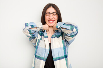 Young caucasian woman isolated on white background suffering neck pain due to sedentary lifestyle.