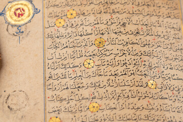 Close up page of rare holy Quran ,Muslim book written by hand with goold 