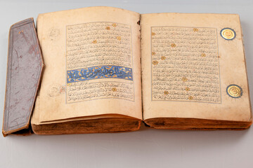 Handwritten pages of the Holy Quran decorated with gold, written 800 years ago