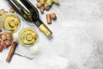 Wine background. White wine with grapes.