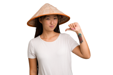 Young asian woman wearing a Vietnamese hat isolated feels proud and self confident, example to follow.