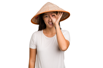 Young asian woman wearing a Vietnamese hat isolated excited keeping ok gesture on eye.