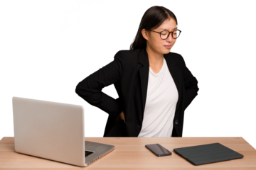 Young business asian woman sitting on a table isolated suffering a back pain.
