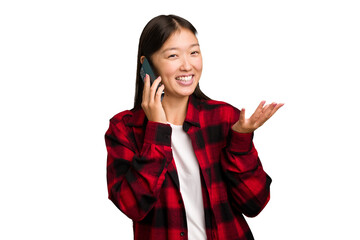 Young asian woman holding a mobile phone isolated