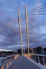 Ypsilon Bridge in Drammen - cable-stayed bridge with pedestrian walkway illuminated by sunset light