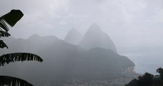 St Lucia Caribbean Piton mountain through rain and clouds. British Commonwealth Island. Piton mountains valley. French were first Europeans to settle the island. Cruise shipvacation destination.