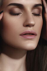 Obraz premium Young Caucasian girl with perfect glowing skin and natural makeup in close-up