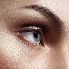 Caucasian woman's gray-blue eye in close-up