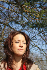 woman enjoy sun with closed eyes
