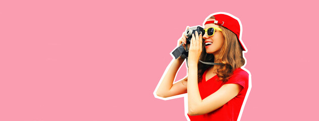 Portrait of happy smiling young woman photographer taking picture on film camera wearing red...