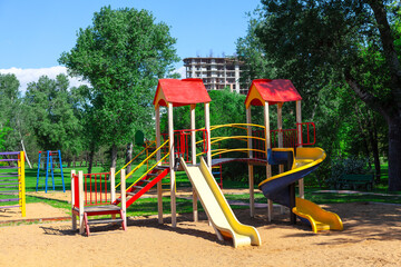 Playground in the public park . Colorful slides of playground for kids