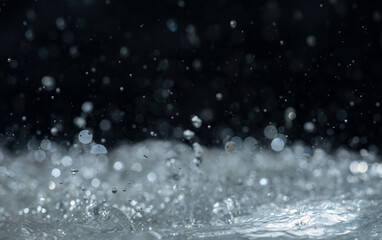 Macro photography of rain on a black background. Abstract background.