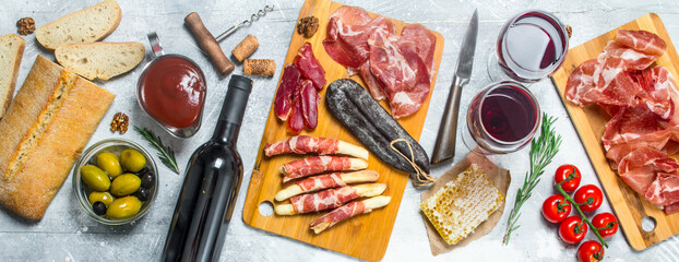 Antipasto background.Various Italian meat snacks.