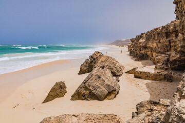 Picturesque rocks on the beach of Varandinha on the vacation island of Boa Vista, Cape Verde