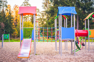 Colorful playground on yard in the park. Colorful children playground activities in public park...