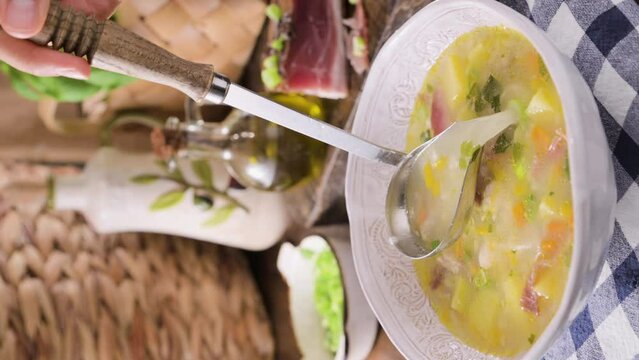 barley soup, zuppa di orzo. Zuppa tradizionale con pancetta e orzo nel nord italia, Trento. Cucina contadina, tipica delle Alpi. High quality 4k footage