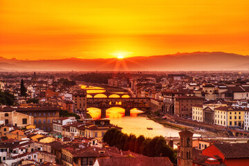 Fototapeta na wymiar Florence Aerial View at Golden Sunset over Ponte Vecchio Bridge
