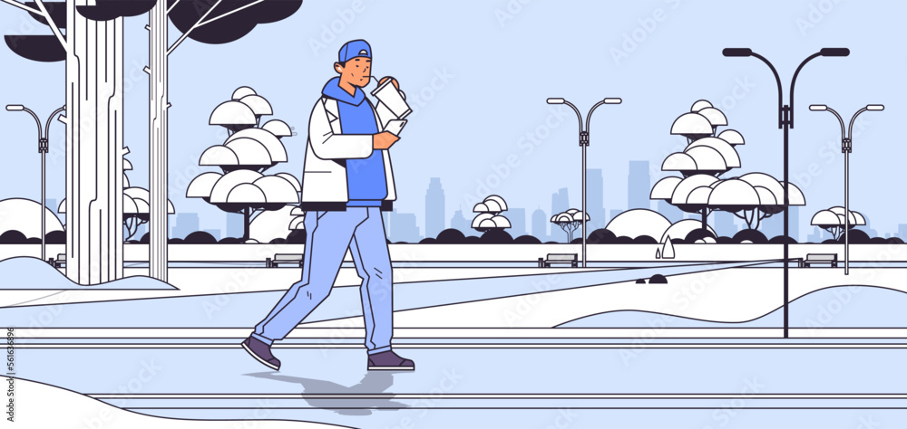 Poster man in casual clothes drinking coffee with straw and using smartphone while walking in urban park so