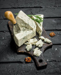 Blue cheese with nuts and rosemary branches.