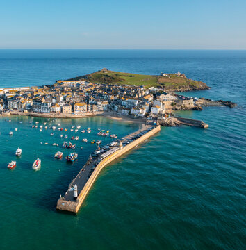 St Ives, Cornwall. United Kingdom. 08.24.2021 A lovely Aerial Image of St Ives Head and Harbour at Sunrise. 24th August 2021.